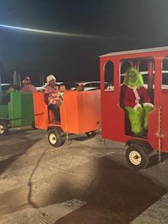 the grinch in a colorful train 